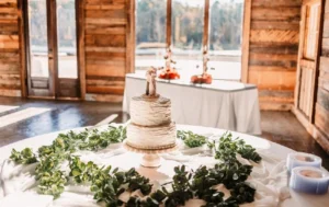 A beautifully decorated wedding cake sits on a table.
