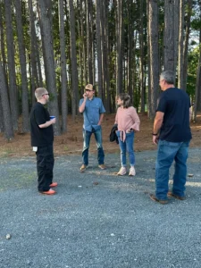 A group of guests chatting outdoors at Peyton’s graduation party.